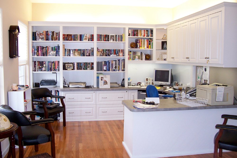 Home office with white custom cabinetry